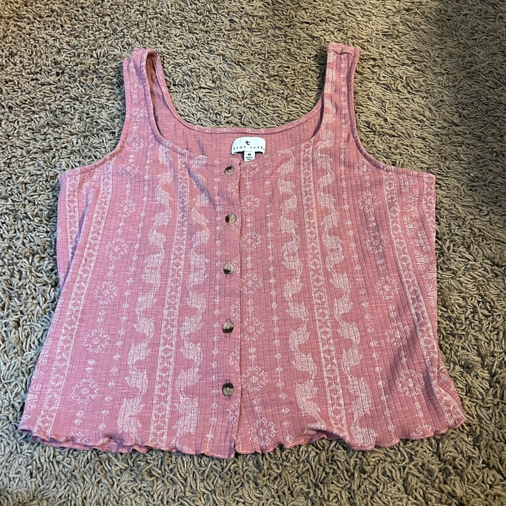 I have never wore this it’s true craft brand size medium pink with design.